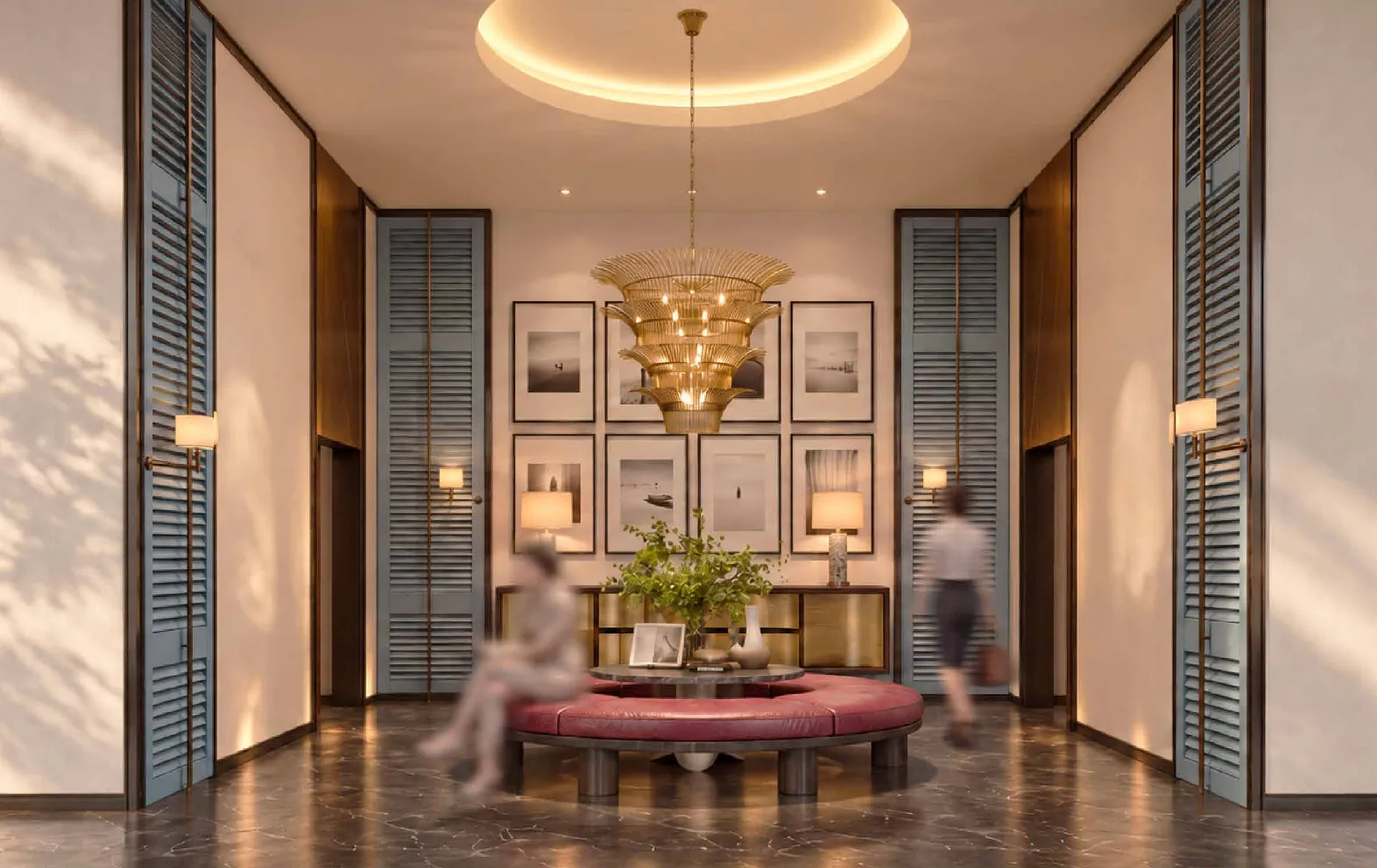 MABA Suitez lift lobby with a round ottoman, a gold pendant light and framed artworks, artist's impression